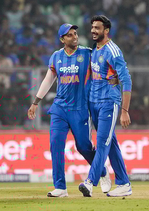 India's Axar Patel, right, celebrates with captain Suryakumar Yadav after taking the wicket of New Zealand's Glenn Phillips during the fifth and final T201 cricket match between India and New Zealand, at the Greenfield International Stadium, in Thiruvananthapuram, Kerala.