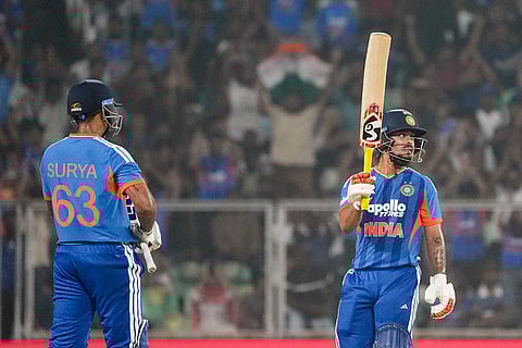 India's Ishan Kishan, right, celebrates his half century with captain Suryakumar Yadav during the fifth and final T20 International cricket match between India and New Zealand, at the Greenfield International Stadium, in Thiruvananthapuram, Kerala.