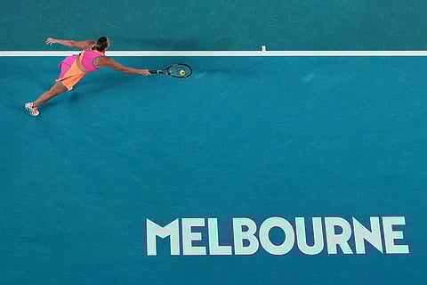 Aryna Sabalenka of Belarus tries to stop a ball from Elena Rybakina of Kazakhstan during the women's singles final at the Australian Open tennis championship in Melbourne, Australia.