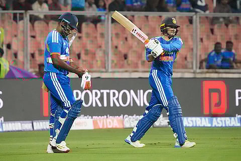 India's Sanju Samson, left, and Abhishek Sharma arrive to bat during the fifth and final T20 International cricket match between India and New Zealand, at the Greenfield International Stadium, in Thiruvananthapuram, Kerala.