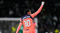 (AP Photo/Jose Breton) : Barcelona's Lamine Yamal celebrates after scoring the opening goal with his teammate Barcelona's Raphinha during a Spanish La Liga soccer match between Elche and Barcelona in Elche, Spain, Saturday, Jan. 31, 2026.