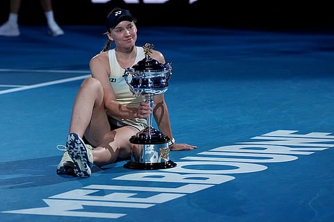 Elena Rybakina of Kazakhstan poses with the Daphne Akhurst Memorial Cup after defeating Aryna Sabalenka of Belarus to win the women's singles final at the Australian Open tennis championship in Melbourne, Australia.