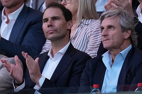 Rafael Nadal, left, and his agent Carlos Costa watch the men's single final between Carlos Alcaraz of Spain and Novak Djokovic of Serbia at the Australian Open tennis championship in Melbourne, Australia.