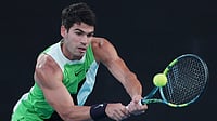 Carlos Alcaraz Vs Novak Djokovic LIVE Score, Australian Open Final: Spaniard Pays Back In Kind; 1-1 In Melbourne Photo: AP : Carlos Alcaraz of Spain plays a backhand to Novak Djokovic of Serbia during the men's singles final at the Australian Open tennis championship in Melbourne.