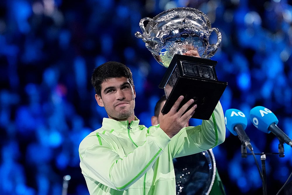 | Photo: AP/Aaron Favila : Carlos Alcaraz of Spain holds the Norman Brookes Challenge Cup after defeating Novak Djokovic of Serbia in the men's singles final at the Australian Open tennis championship in Melbourne, Australia.