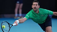 Photo: AP : Novak Djokovic of Serbia plays a forehand to Carlos Alcaraz of Spain during the men's singles final at the Australian Open tennis championship in Melbourne.