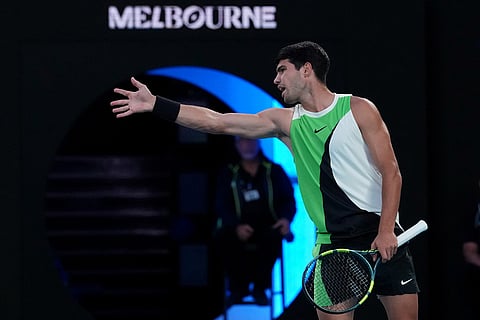 Carlos Alcaraz of Spain reacts during his match against Novak Djokovic of Serbia in the men's singles final at the Australian Open tennis championship in Melbourne, Australia.