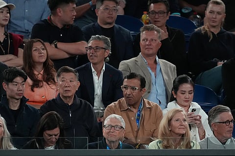Microsoft co-founder Bill Gates, center bottom, watches Carlos Alcaraz of Spain and Novak Djokovic of Serbia during the men's singles final at the Australian Open tennis championship in Melbourne, Australia.