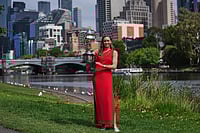 | Photo: AP/Dita Alangkara : Elena Rybakina of Kazakhstan poses with Daphne Akhurst Memorial Cup on the banks of the Yarra River the morning after defeating Aryna Sabalenka of Belarus in the women's singles final at the Australian Open tennis championship in Melbourne, Australia.