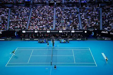 Novak Djokovic of Serbia, left, and Carlos Alcaraz of Spain play in their final match at the Australian Open tennis championship in Melbourne, Australia.