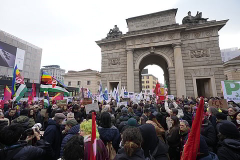 People take part in an Anti-ICE demonstration, ahead of the 2026 Winter Olympics, in Milan, Italy.