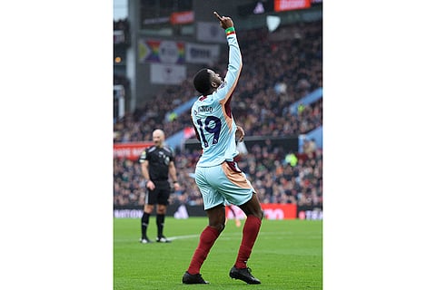 Brentford's Dango Ouattara celebrates scoring during the English Premier League soccer match between Aston Villa and Brentford, in Birmingham, England.