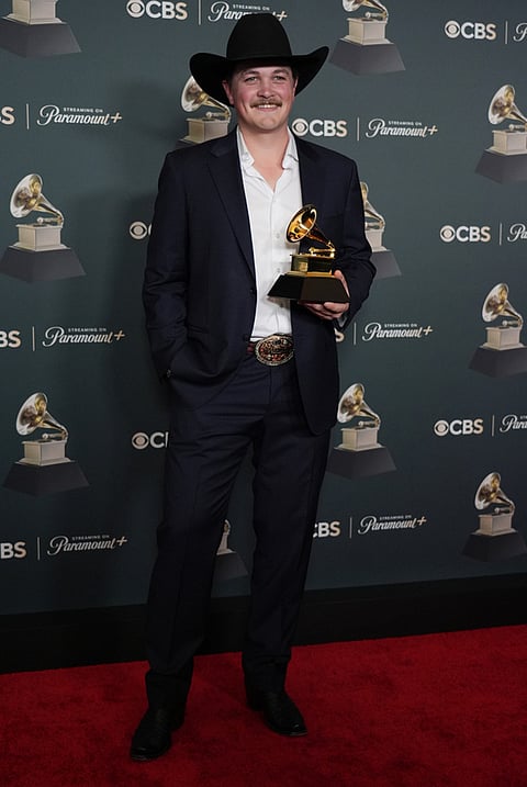 Zach Top poses in the press room with the award for best traditional country album for "Ain't in It for My Health" during the 68th annual Grammy Awards in Los Angeles. 