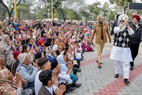 Dera Beas Chief Baba Gurinder Singh Dhillon greets his followers gathered near the Nabha Central Jail, in Nabha.