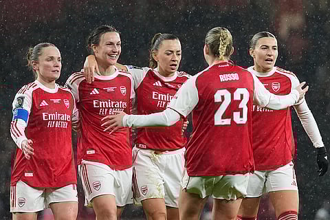 Arsenal's Lotte Wubben-Moy, 2nd left, celebrates after scoring her side's second goal during the Women's Champions Cup final soccer match between Arsenal FC and SC Corinthians in London.