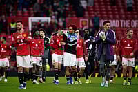 | Photo: AP/Dave Thompson : Manchester United players celebrate at the end of the English Premier League soccer match between Manchester United and Fulham in Manchester, England.
