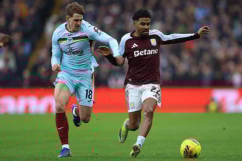 Brentford's Yehor Yarmolyuk (left) and Aston Villa's Ian Maatsen battle for the ball during the English Premier League soccer match between Aston Villa and Brentford, in Birmingham, England.