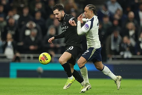 Tottenham's Xavi Simons, right, challenges Manchester City's Rayan Cherki during the English Premier League soccer match between Tottenham Hotspur and Manchester City in London.