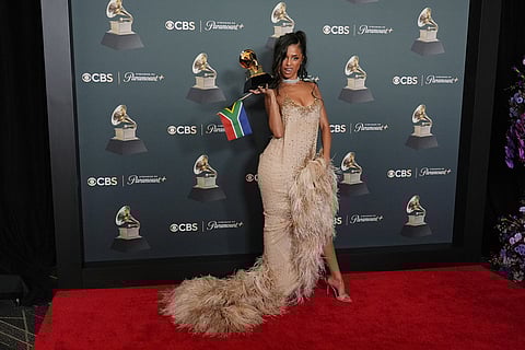 Tyla poses in the press room with the award for best African music performance for "Push 2 Start" during the 68th annual Grammy Awards in Los Angeles. 