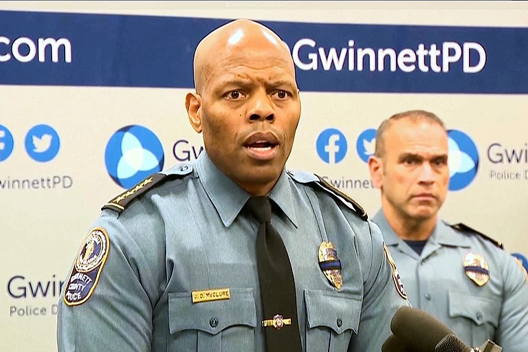 An image taken from WSB video shows Gwinnett County Police Chief J.D. McClure speaks at a news conference Sunday, Feb. 1, 2026, in Gwinnett County, Ga., following the shootings of two officers at a hotel. - (WSB via AP)