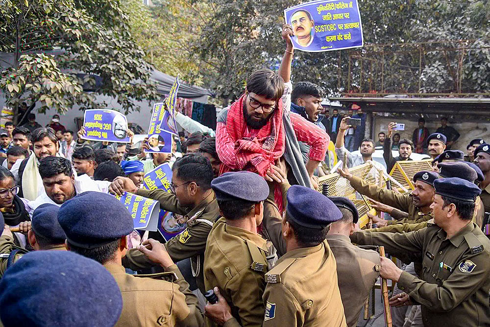 Police detain students of Patna University during a 'Justice March' held in support of the UGC Regulations 2026, in Patna. - | Photo: PTI