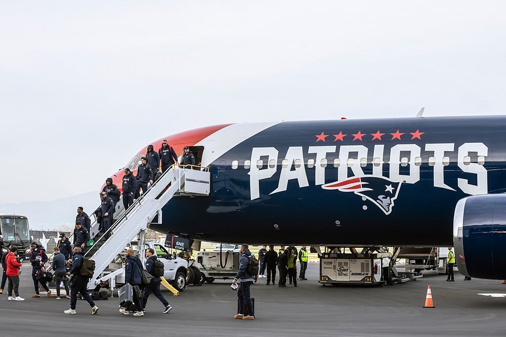 New England Patriots players disembark at Mineta International Airport in San Jose, California, ahead of NFL football's Super Bowl LX.  - | Photo: Carlos Avila Gonzalez/San Francisco Chronicle via AP