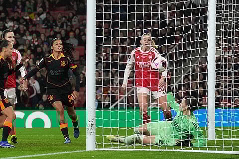 Arsenal's goalkeeper Anneke Borbe, on the ground, fails to stop the ball going over the line to allow Corinthian's first goal, by team captain Gabi Zanotti, during the Women's Champions Cup final soccer match between Arsenal FC and SC Corinthians in London.