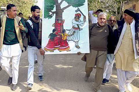 Environmental activists and members of the Bishnoi community take part in the 'Save Khejri Movement', protesting against the proposed cutting of Khejri trees for a solar power plant, in Bikaner.