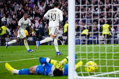 Real Madrid's Kylian Mbappe celebrates after scoring his side's second goal during the Spanish La Liga soccer match between Real Madrid and Rayo Vallecano in Madrid, Spain.