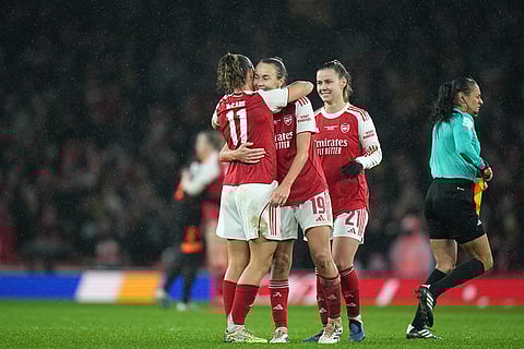 Arsenal's Katie McCabe, Caitlin Foord and Victoria Pelota, from left, celebrate at the the end of the Women's Champions Cup final soccer match between Arsenal FC and SC Corinthians in London.