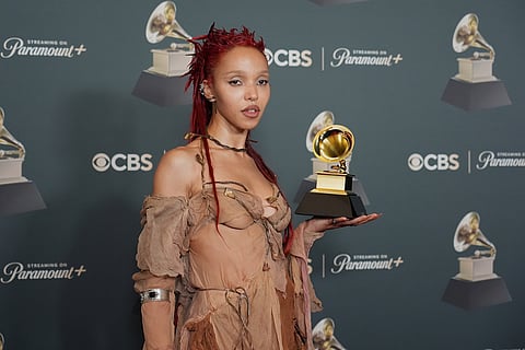 FKA Twigs poses in the press room with the award for best dance/electronic album for "EUSEXUA" during the 68th annual Grammy Awards in Los Angeles. 