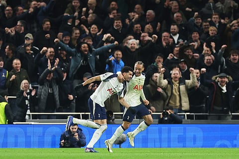 Tottenham's Dominic Solanke, left, celebrates scoring his side's 2nd goal with Xavi Simons during the English Premier League soccer match between Tottenham Hotspur and Manchester City in London.