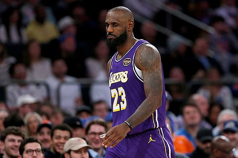 Los Angeles Lakers forward LeBron James walks up court during the second half of an NBA basketball game against the New York Knicks in New York.
