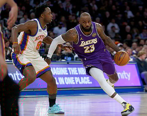 New York Knicks forward OG Anunoby, left, defends Los Angeles Lakers forward LeBron James, right, during the second half of an NBA basketball game in New York. 