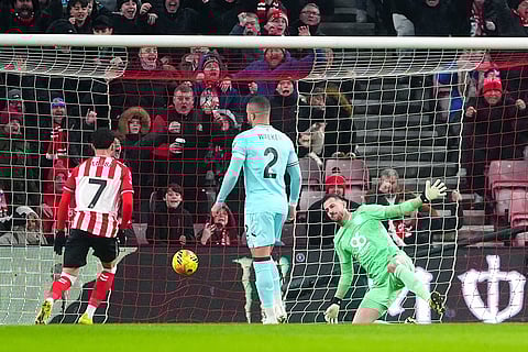 Burnley goalkeeper Martin Dubravka, right, fails to block a goal by Sunderland during a Premier League soccer match in Sunderland.