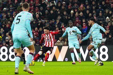 Sunderland's Chemsdine Talbi, center left, scores their side's third goal of the game during the Premier League soccer match against Burnley, at the Stadium of Light, in Sunderland, England.