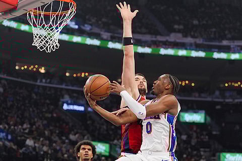 Philadelphia 76ers guard Tyrese Maxey (0) puts up a shot against Los Angeles Clippers center Ivica Zubac (40) during the first half of an NBA basketball game in Inglewood, California.