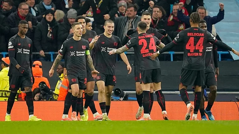 Leverkusen's Patrik Schick is congratulated by teammate Leverkusen's Aleix Garcia (24), after he scored his sides second gaol during the Champions League opening phase soccer match between Manchester City and Bayer Leverkusen in Manchester, England. - | Photo: AP/Dave Thompson
