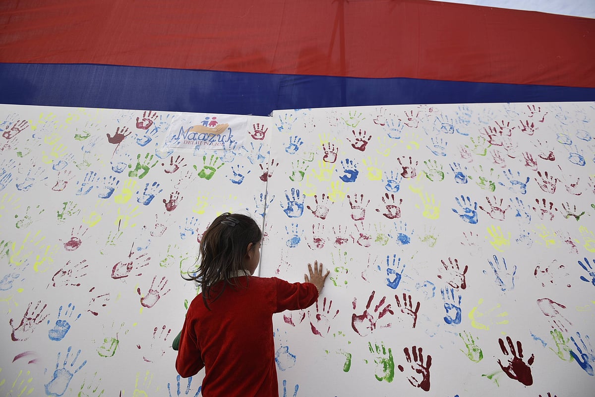  A girl seen putting her handprint over an installation during an awareness campaign program initiated by Delhi Police for those children who were missing and kidnapped but later been reunited, at DCP Complex, on February 21, 2019 in New Delhi, India. Over 130 missing children were reunited with their families by the Anti-Human Trafficking Unit (AHTU) of northeast district police in 2018 and 2019. (Photo by Biplov Bhuyan Hindustan Times)
Source: IMAGO / Hindustan Times 
 - null