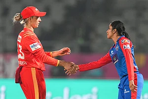 | Photo: PTI/Kunal Patil : Delhi Capitals' captain Jemimah Rodrigues, right, shakes hands with Gujarat Giants' captain Ashleigh Gardner after her team's win over Gujarat Giants in the Women's Premier League (WPL) 2026 eliminator T20 cricket match, in Vadodara, Gujarat.