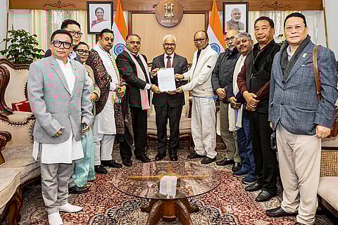 Manipur Governor Ajay Bhalla, centre, meets BJP Manipur leader Yumnam Khemchand Singh, fifth right, and others, who submitted the claim to form a BJP-led NDA government, at the Raj Bhavan, in Imphal. 