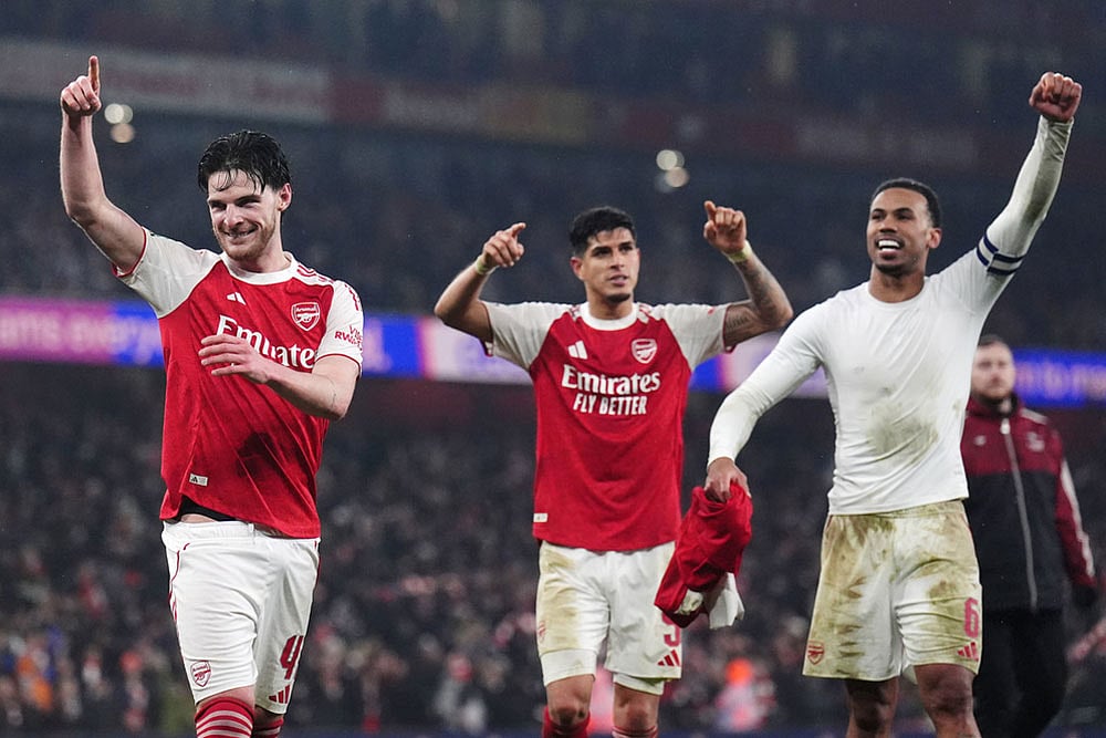 Arsenal players, from left, Declan Rice, Piero Hincapie and Gabriel celebrate after the English League Cup semifinal second leg soccer match between Arsenal and Chelsea in London. - Photo: John Walton/PA via AP