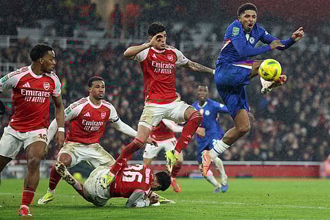 Chelsea's Wesley Fofana, right, kicks the ball during the English League Cup semifinal second leg soccer match between Arsenal and Chelsea in London.