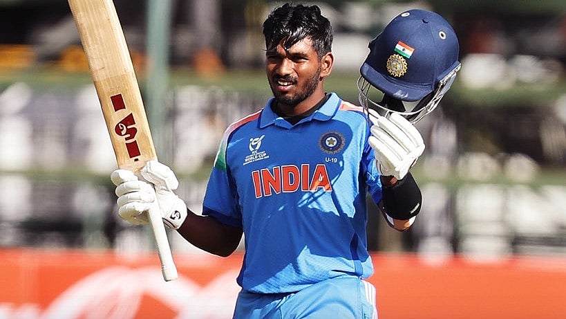 | Photo: X/cricketworldcup : India U19's Aaron George celebrates his century during the ICC U19 Cricket World Cup match against Afghanistan U19 on February 4, 2026.