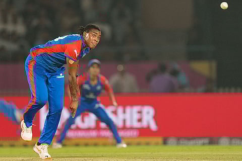Delhi Capitals' Chinelle Henry bowls during the Women's Premier League (WPL) 2026 eliminator T20 cricket match between Gujarat Giants and Delhi Capitals, in Vadodara, Gujarat.