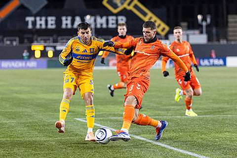 Tigres UANL's Angel Correa (7) fights for a ball with Forge FC's Marko Jevremovic (3) during round one of the 2026 CONCACAF Champions Cup in Hamilton.