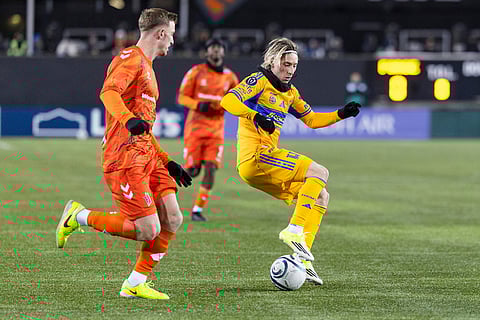 Tigres UANL's Marcelo Flores (20) tries to move the ball past Forge FC's Benjamin Paton (6) during round one of the 2026 CONCACAF Champions Cup in Hamilton.