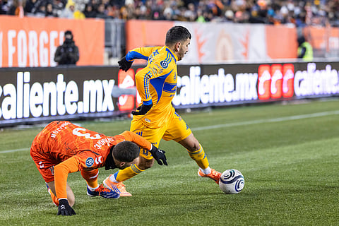 Tigres UANL's Angel Correa (7) fights for a ball with Forge FC's Marko Jevremovic (3) during round one of the 2026 CONCACAF Champions Cup in Hamilton.