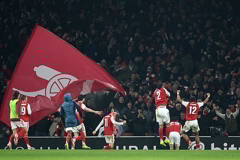 Arsenal's Kai Havertz, second right, celebrates with teammates after scoring the opening goal during the English League Cup semifinal second leg soccer match between Arsenal and Chelsea in London.