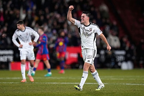 Albacete's Javi Moreno celebrates his side's first goal during a Copa del Rey quarterfinal soccer match between Albacete and Barcelona, in Albacete, Spain.